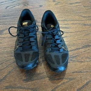 Nike Training REAX shoes in black and gold.